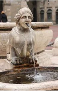 woman's head fountain spouting water